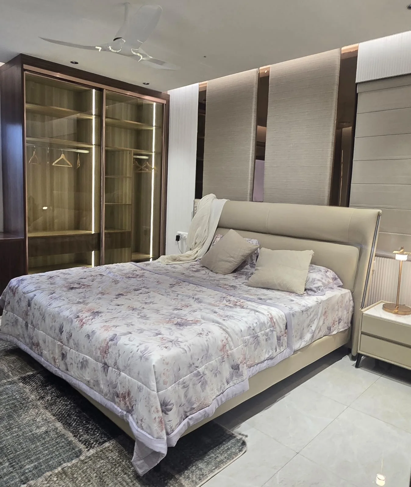 Neutral bedroom with illuminated wardrobe