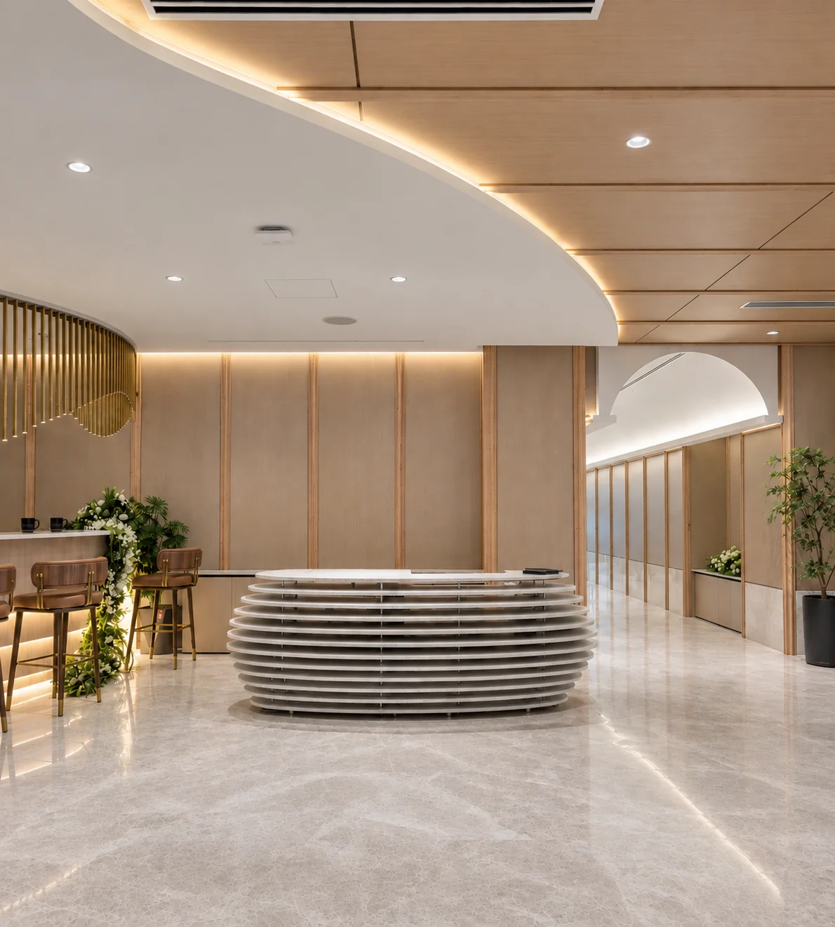 Reception desk framed by warm timber and a curved ceiling