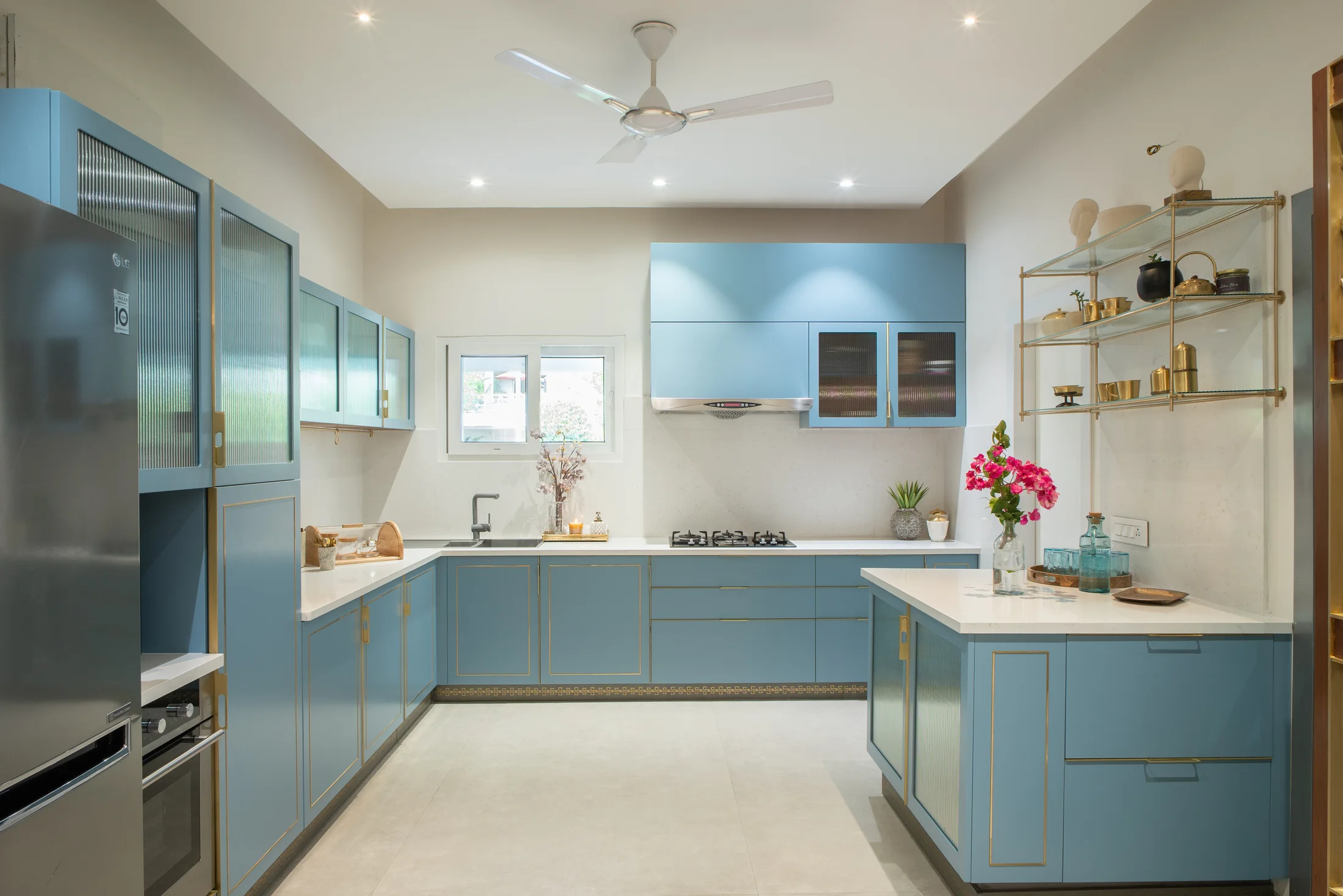 Award-winning open kitchen with blue-green cabinetry and island