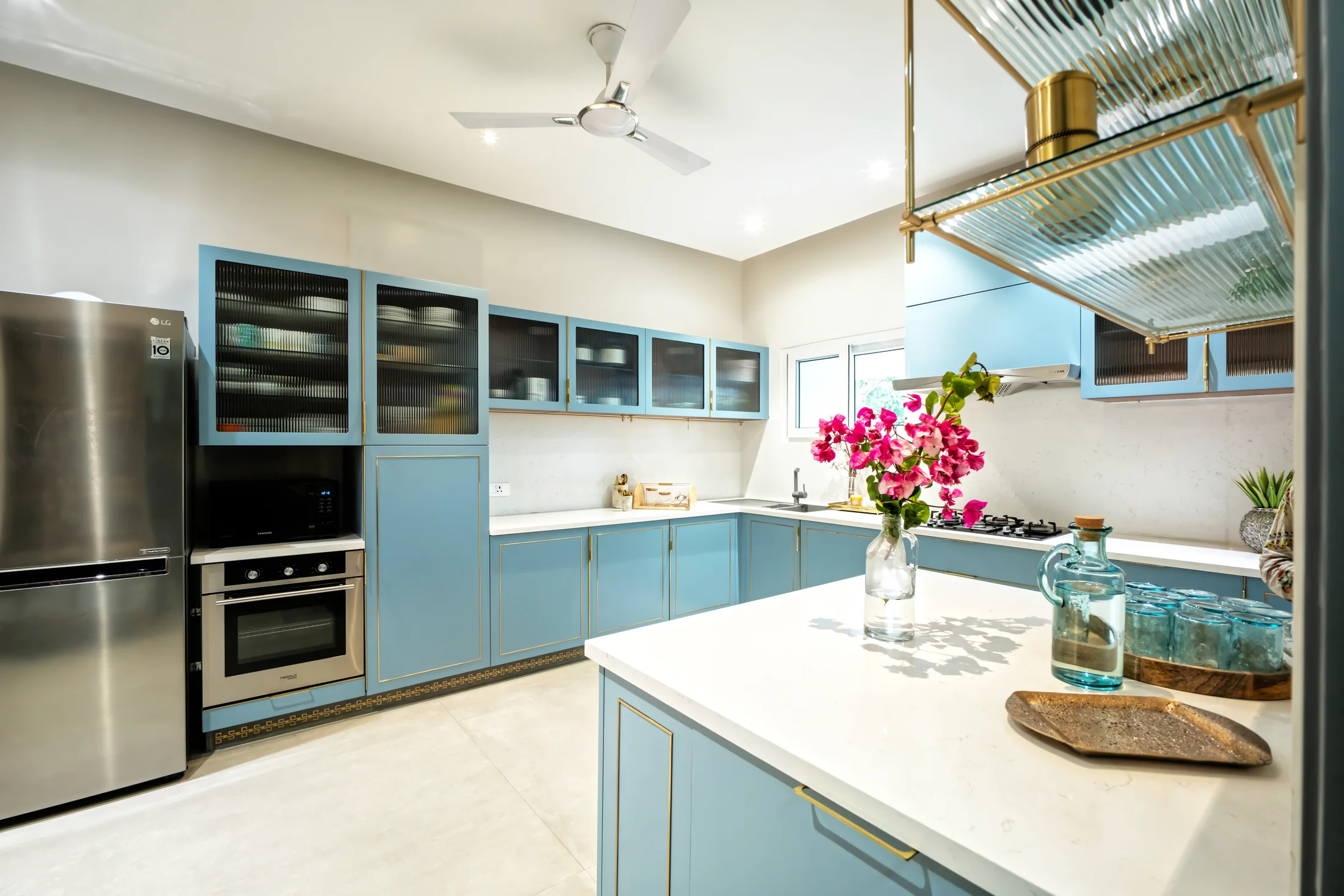 Open-kitchen island and custom brass shelving