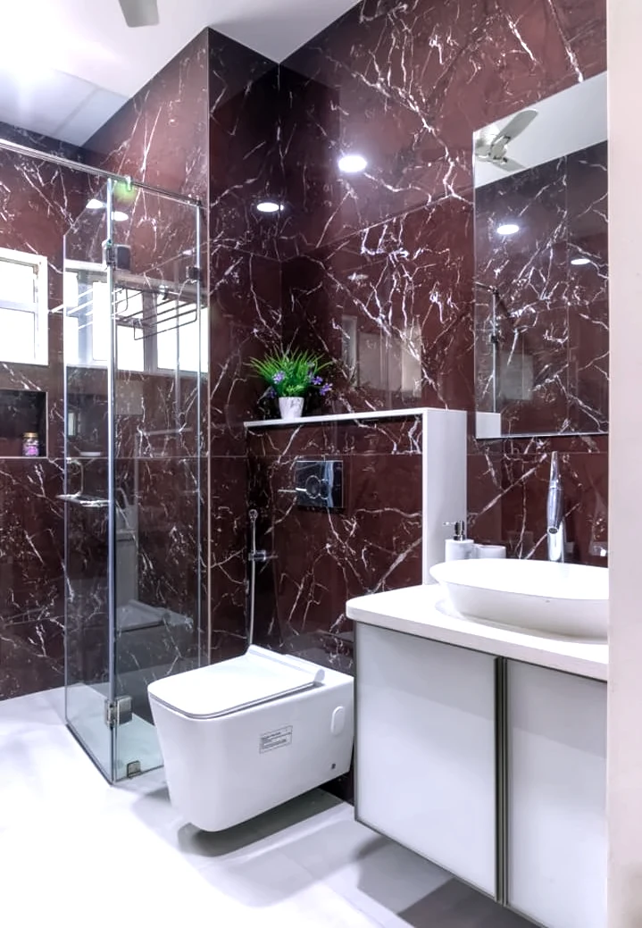 Bathroom finished in deep red stone